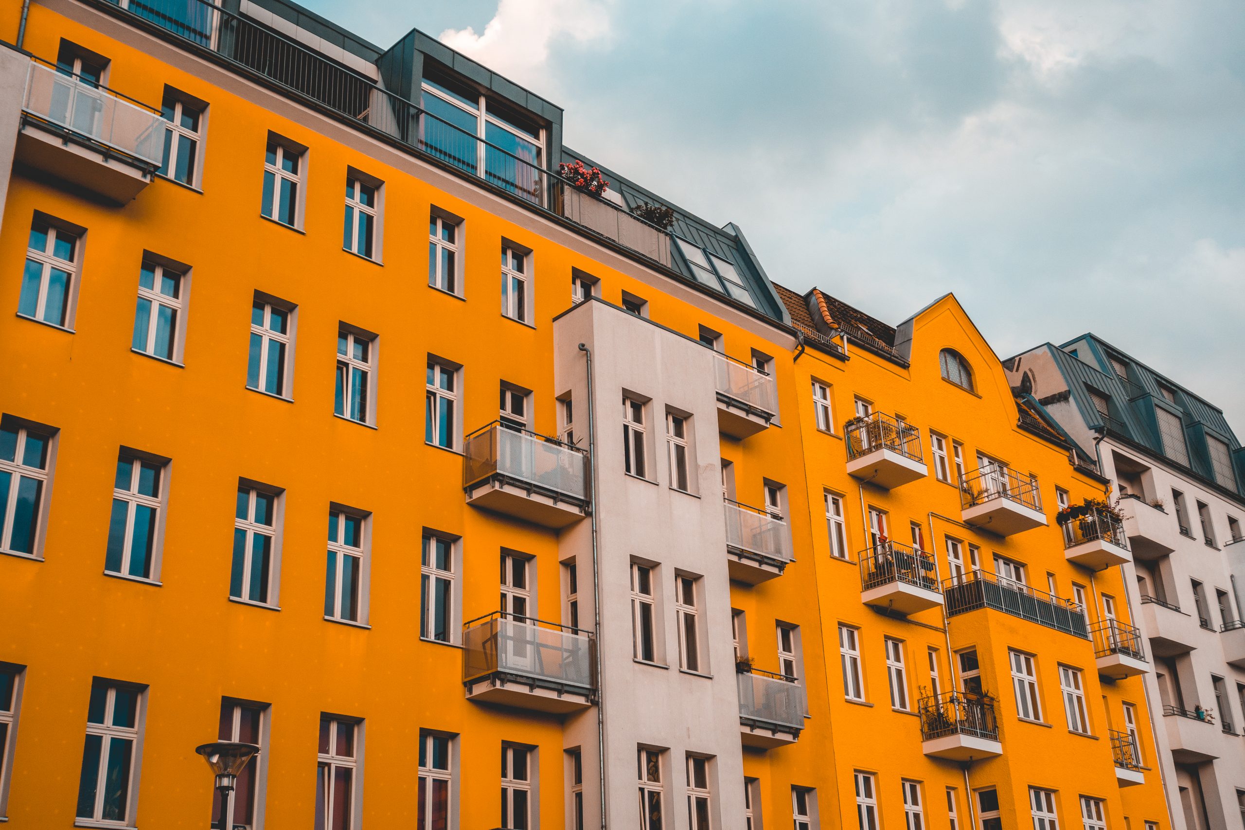 orange-and-white-building-on-darken-cloudy